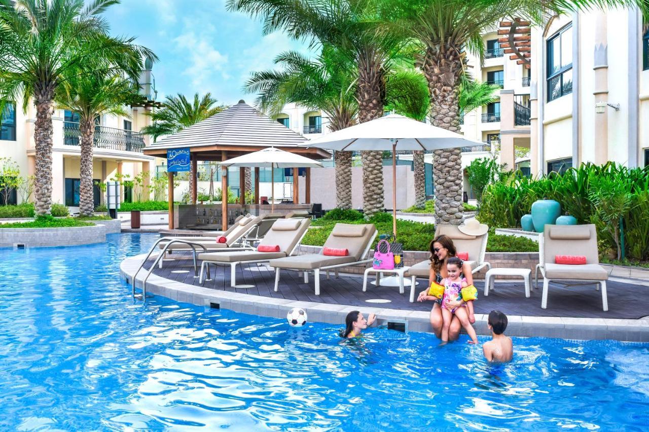 Hotel Al Ain Rotana Exterior foto The swimming pool at the resort